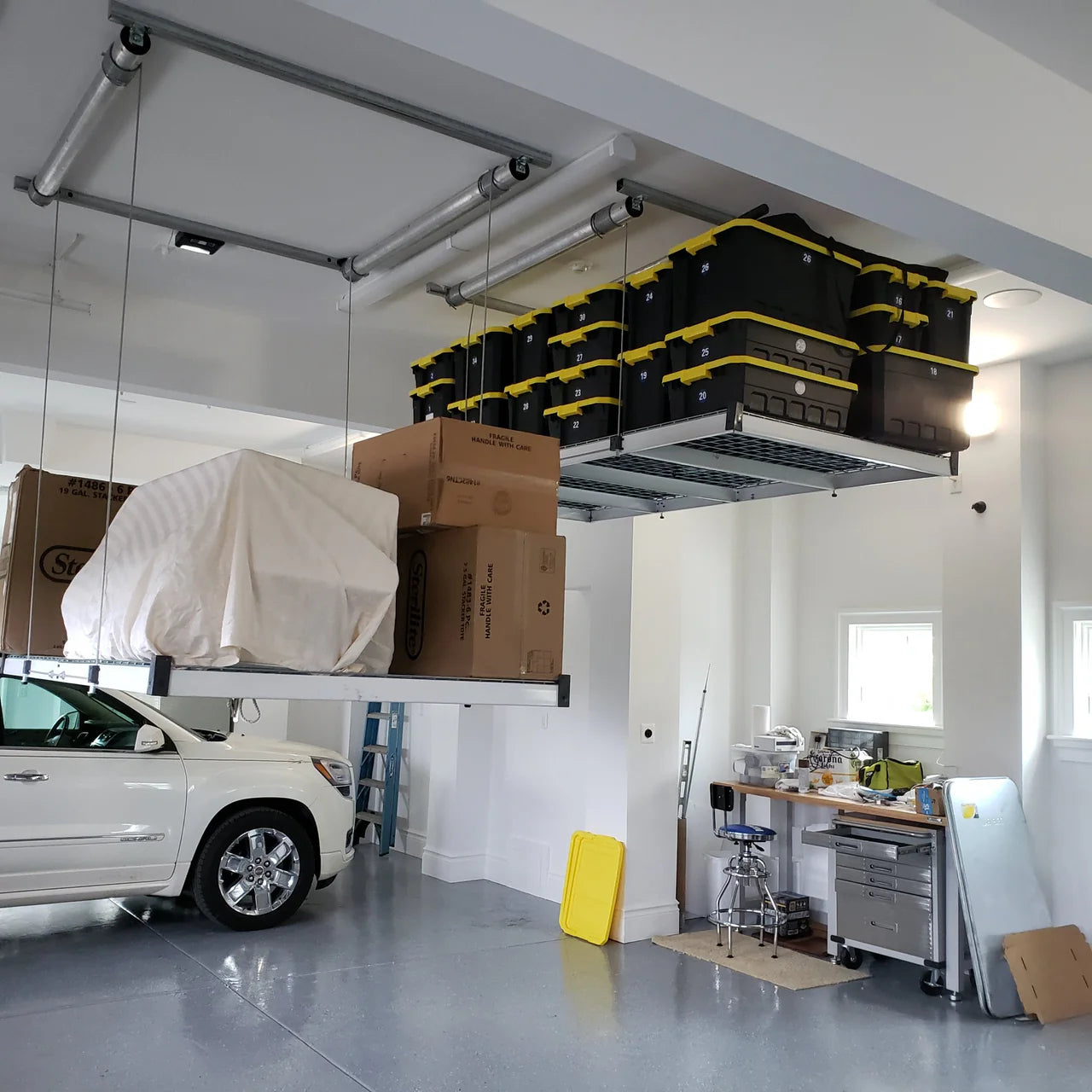 Why Ceiling-Mounted Storage is a Game Changer for Your Garage